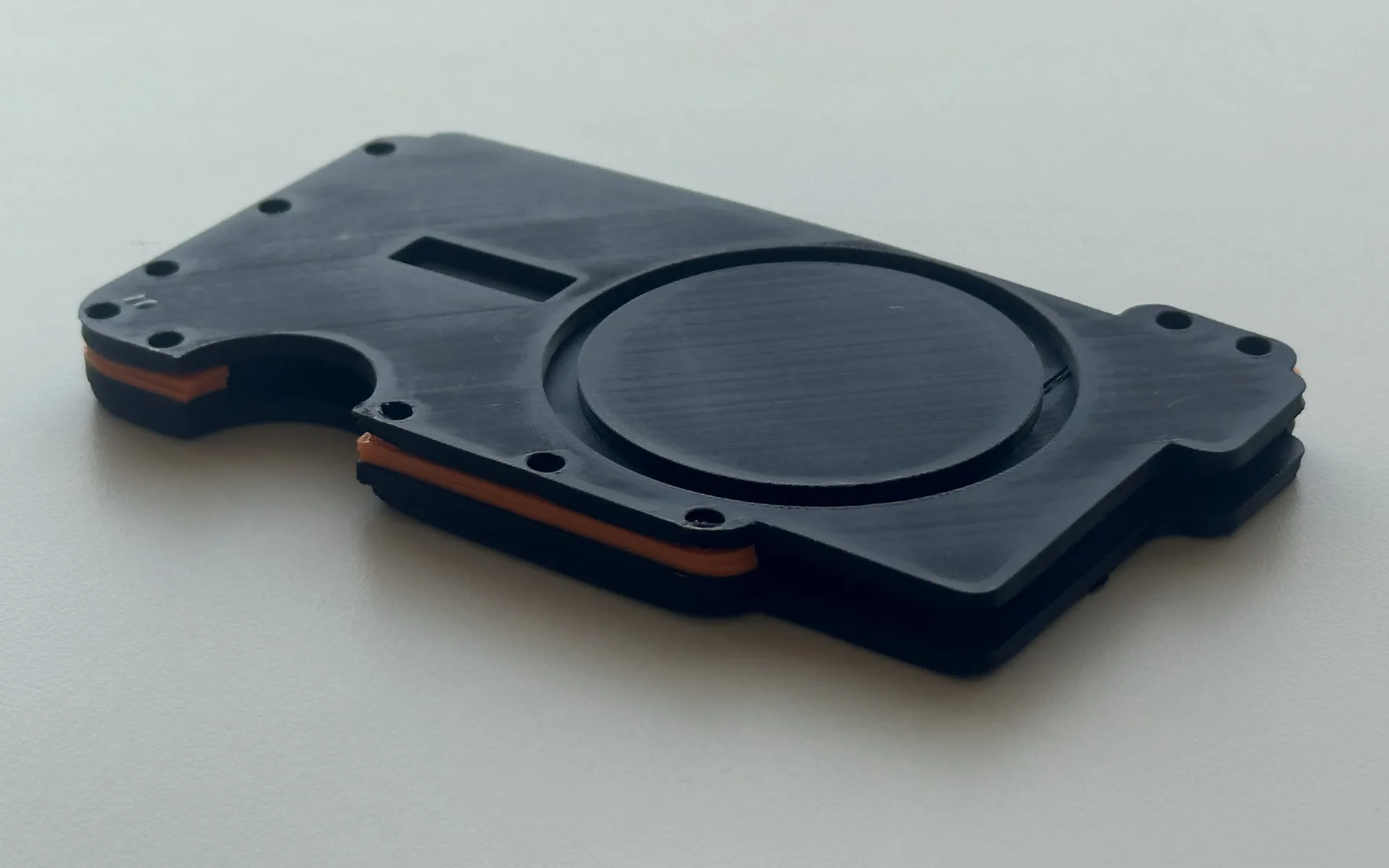 3D-printed MagWallet prototype with its MagSafe ring and layered body